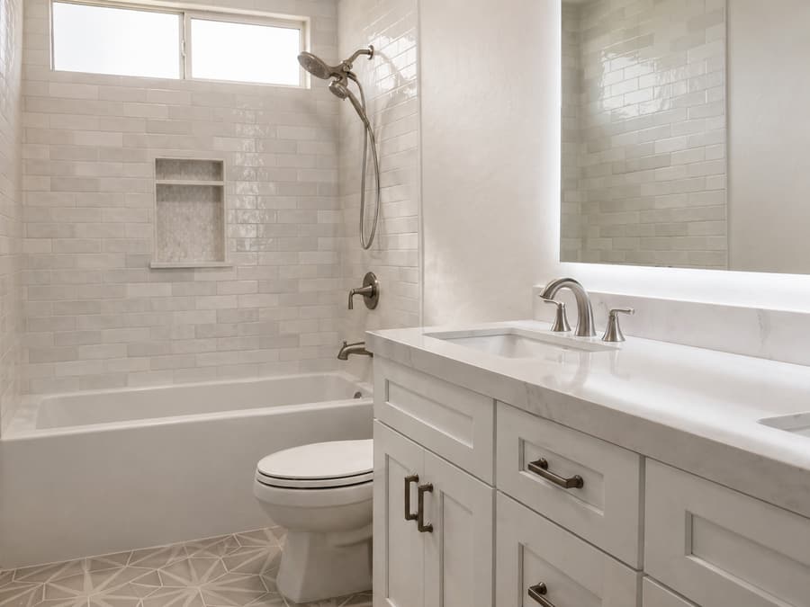 Finished bathroom tile remodel with custom detailing