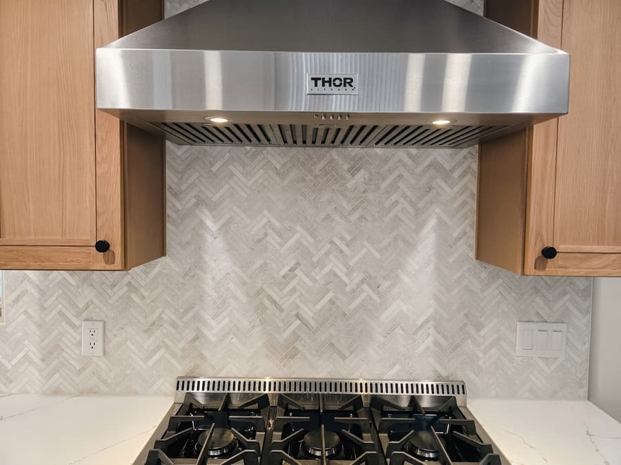 Kitchen backsplash tile installation spanning a countertop run.
